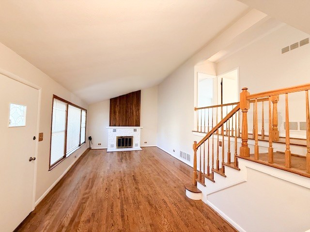 363 Maple Street Glen Ellyn, IL 60137 - Photo 2 of 17 a view of an empty room with wooden floor and windows