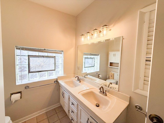 363 Maple Street Glen Ellyn, IL 60137 - Photo 9 of 17 a bathroom with a sink and a mirror