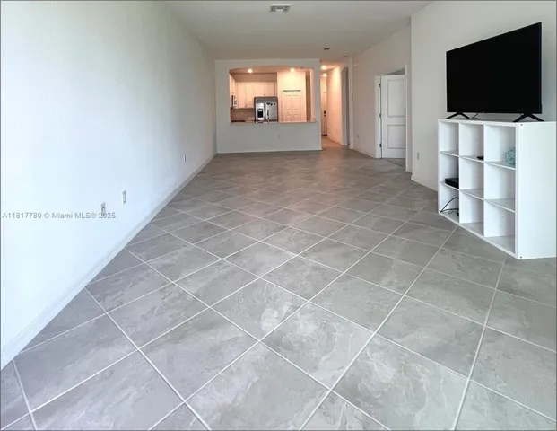 a view of a livingroom with a flat screen tv