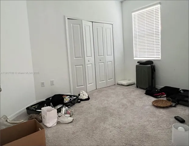 a room with a couch and a window