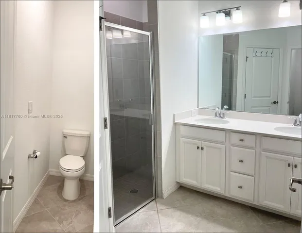 a bathroom with a toilet sink and a mirror