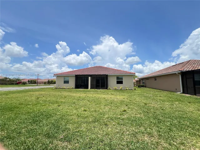 a view of a backyard of the house