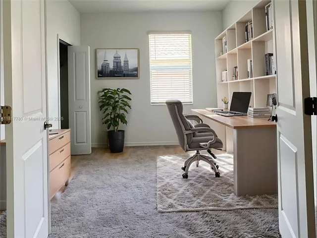 a workspace with furniture and window