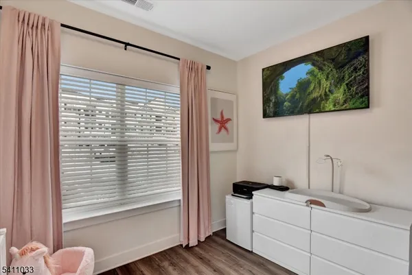 a view of cabinets and wooden floor
