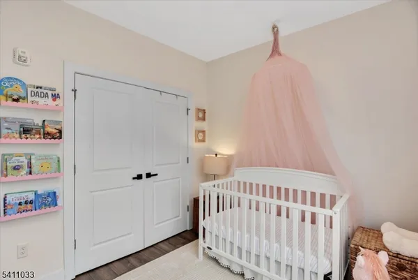 a bedroom with a bed and book shelf