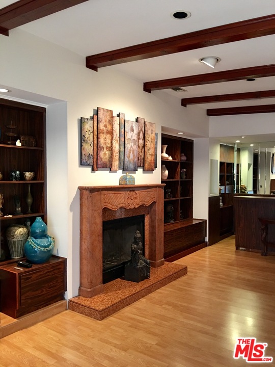 4836 Tyrone Avenue Sherman Oaks, CA 91423 - Photo 2 of 8 a living room with furniture and a fireplace