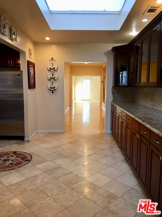 4836 Tyrone Avenue Sherman Oaks, CA 91423 - Photo 4 of 8 a view of a refrigerator in a kitchen