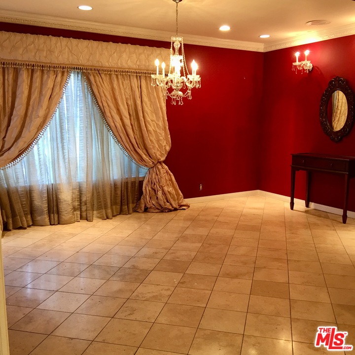 4836 Tyrone Avenue Sherman Oaks, CA 91423 - Photo 6 of 8 a bedroom with a bed and a chandelier