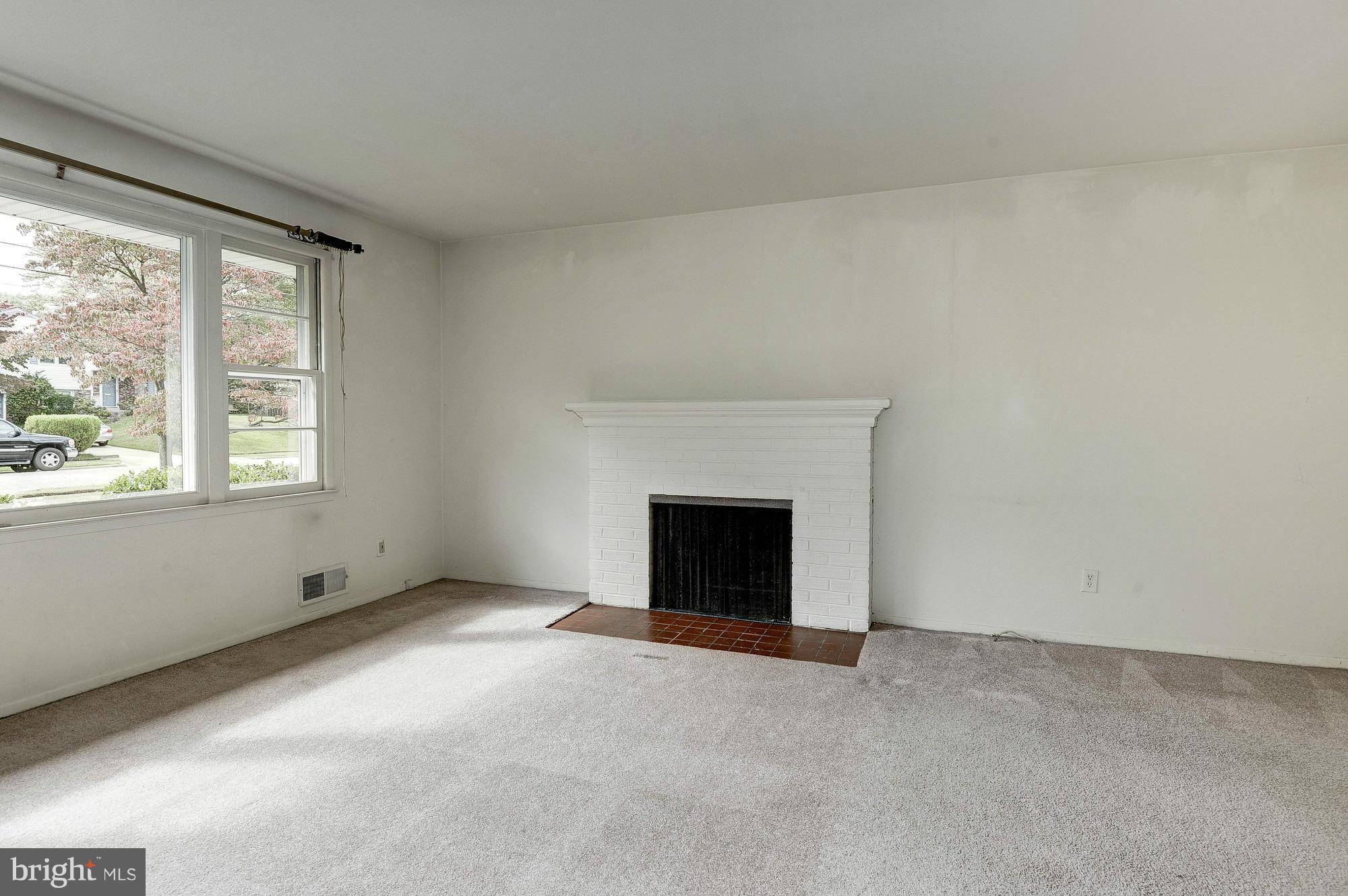 8114 Carrick Lane Springfield, VA 22151 - Photo 6 of 23 Living Room with brick wood burning fireplace