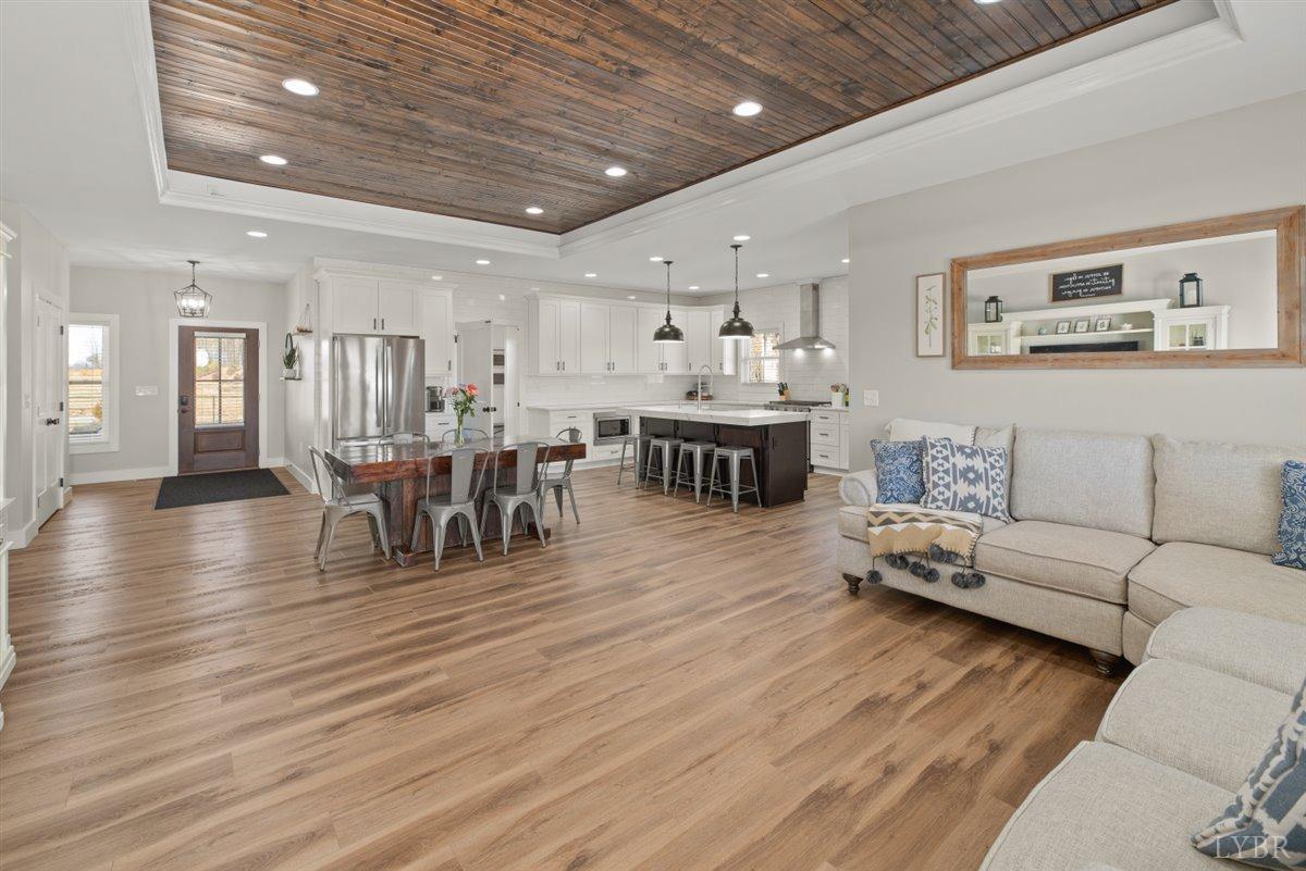 4639 Lowry Road Goode, VA 24556 - Photo 12 of 76 a living room with furniture and a wooden floor