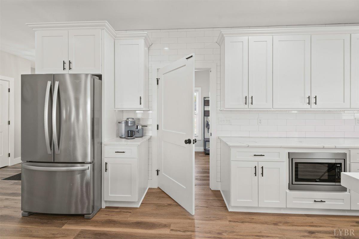 4639 Lowry Road Goode, VA 24556 - Photo 16 of 76 a kitchen with stainless steel appliances granite countertop a refrigerator and a stove