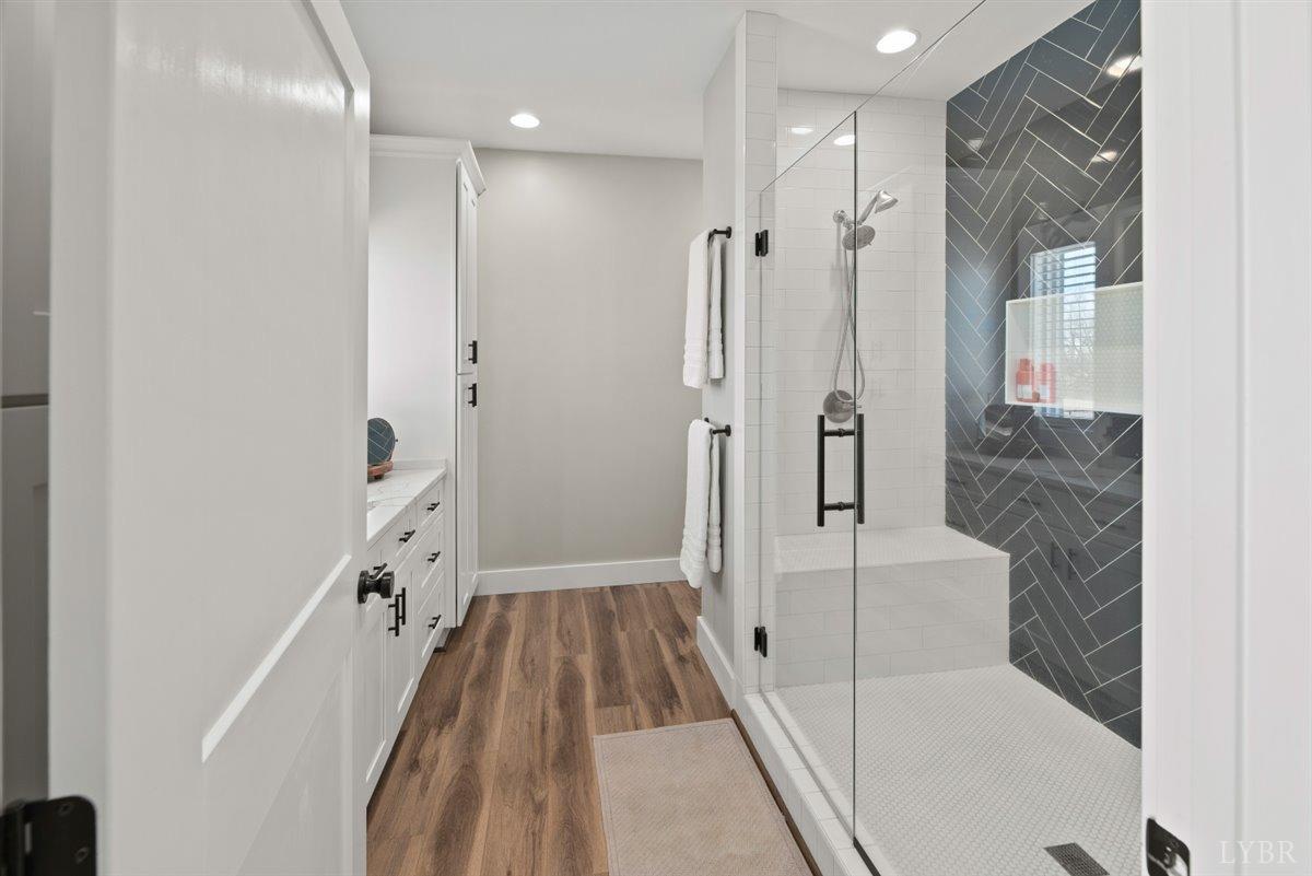 4639 Lowry Road Goode, VA 24556 - Photo 28 of 76 a bathroom with a bathtub and a shower