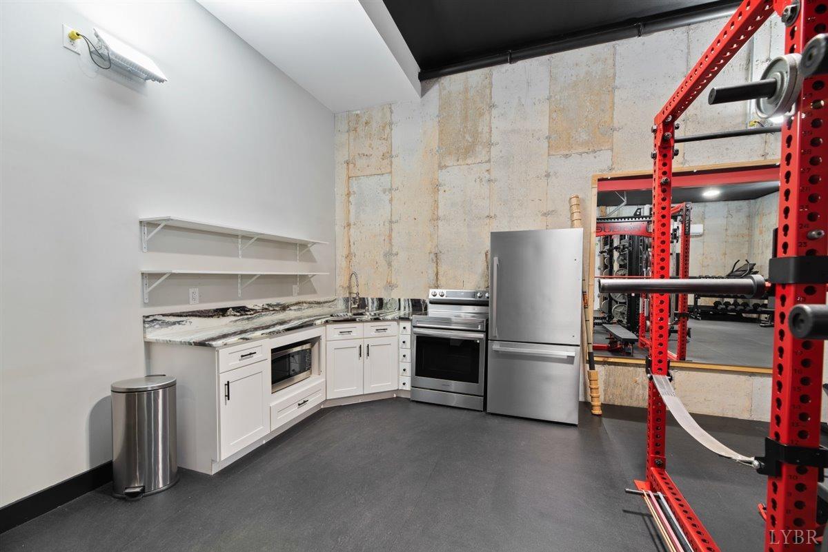 4639 Lowry Road Goode, VA 24556 - Photo 39 of 76 a kitchen with a stove and a refrigerator
