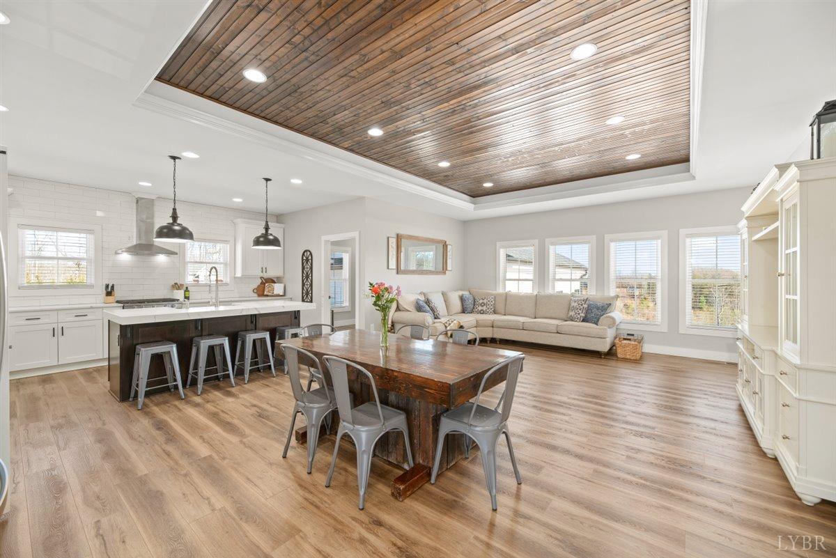 4639 Lowry Road Goode, VA 24556 - Photo 4 of 76 a view of a dining room with furniture window and wooden floor