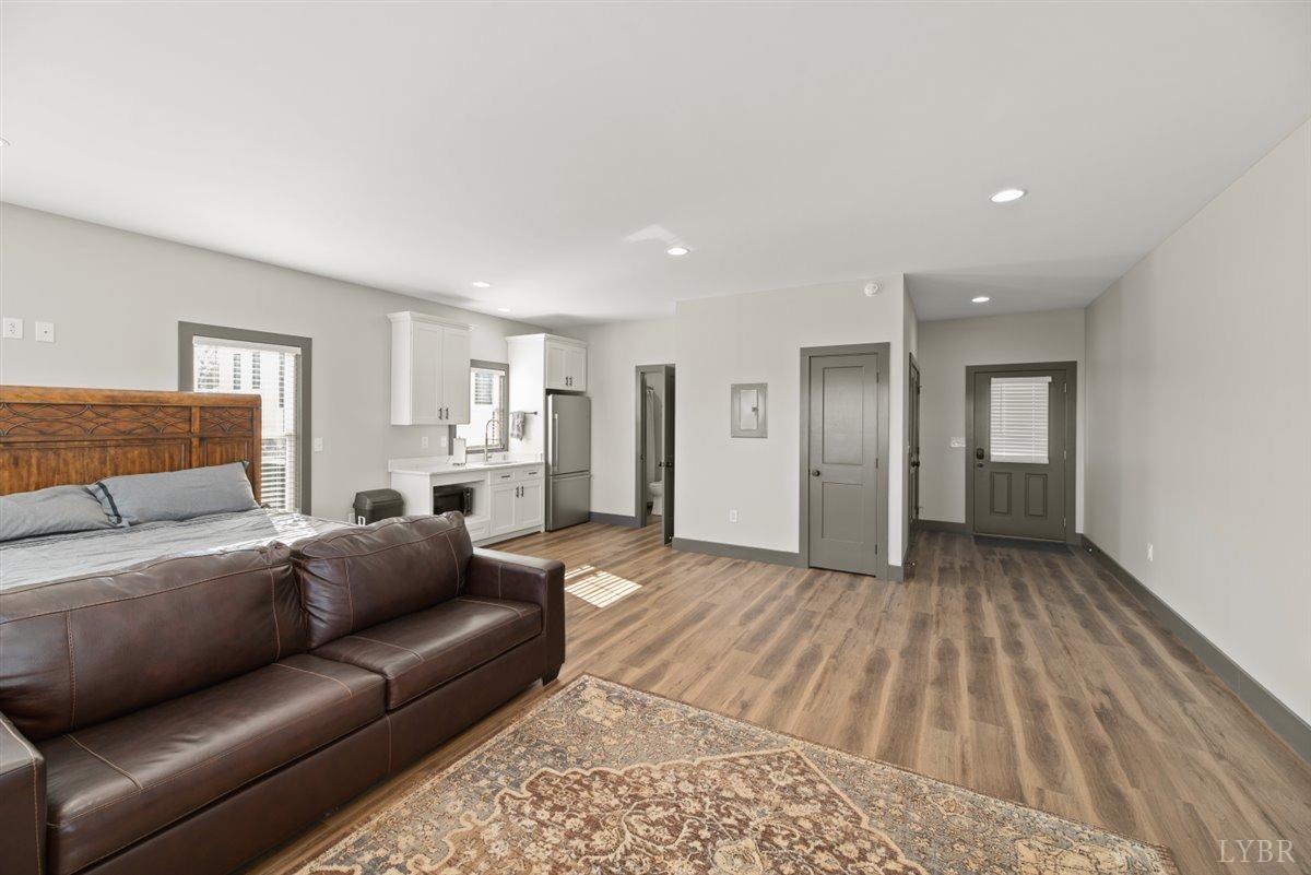 4639 Lowry Road Goode, VA 24556 - Photo 51 of 76 a living room with a couch and a dresser