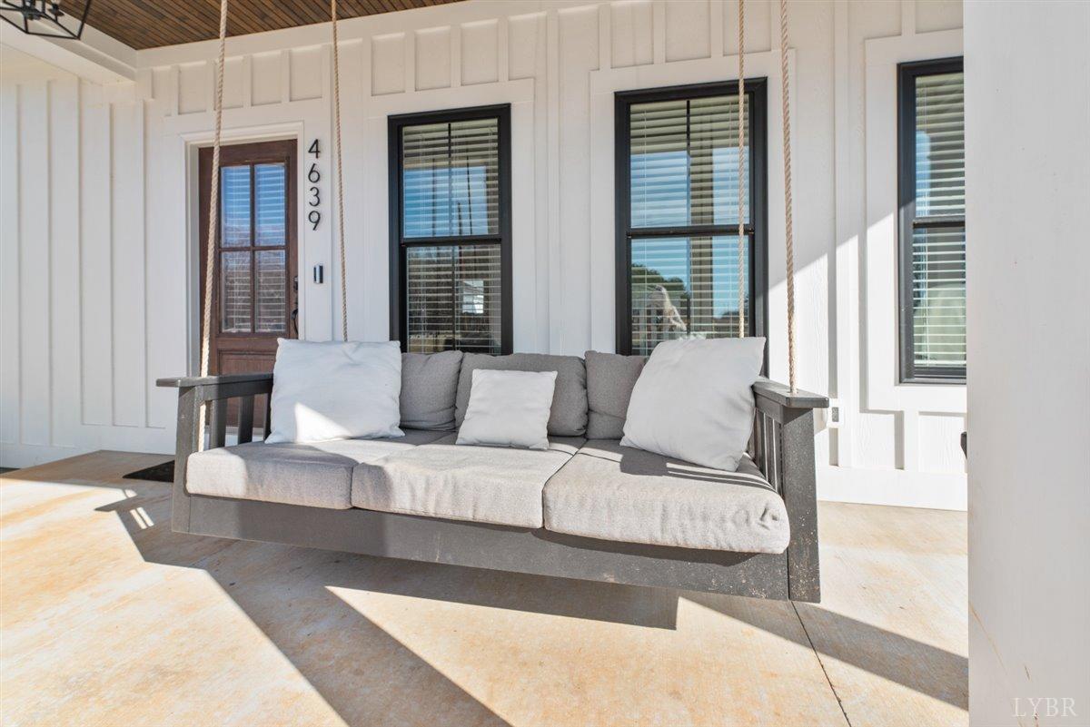 4639 Lowry Road Goode, VA 24556 - Photo 56 of 76 a living room with furniture and large windows
