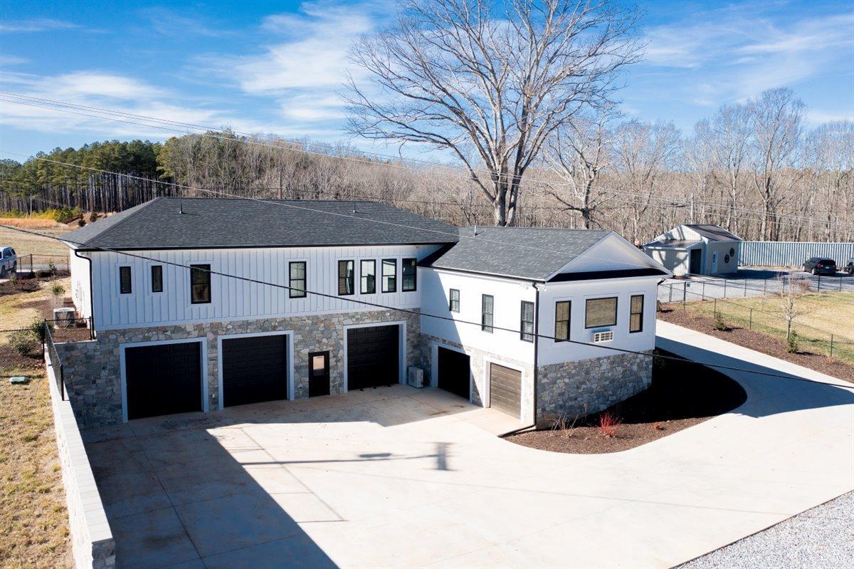 4639 Lowry Road Goode, VA 24556 - Photo 67 of 76 a front view of a house with a yard