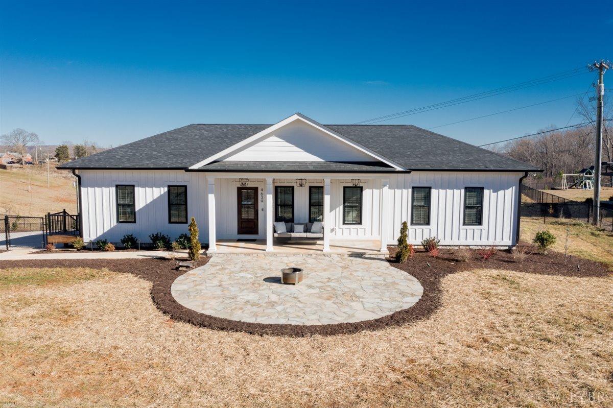 4639 Lowry Road Goode, VA 24556 - Photo 76 of 76 a view of a house with a yard and sitting area