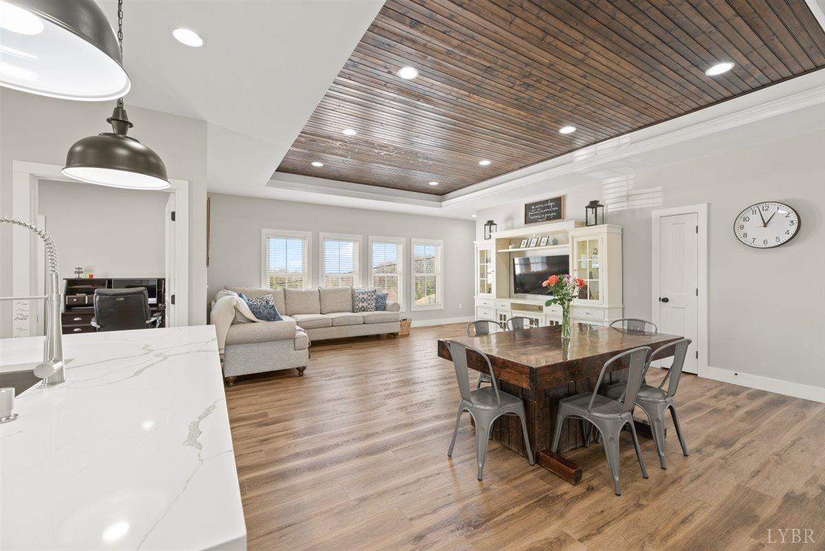 4639 Lowry Road Goode, VA 24556 - Photo 9 of 76 a view of a dining room with furniture and wooden floor