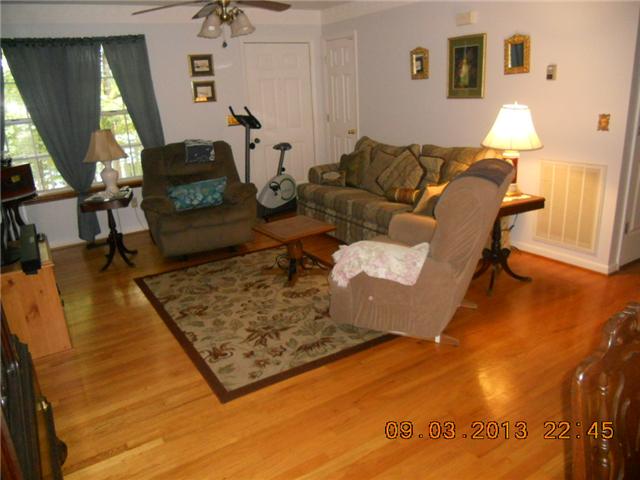 904 Woodhaven Road Lyles, TN 37098 - Photo 7 of 15 Living room, open to dining/kitchen area. Hardwood floors.