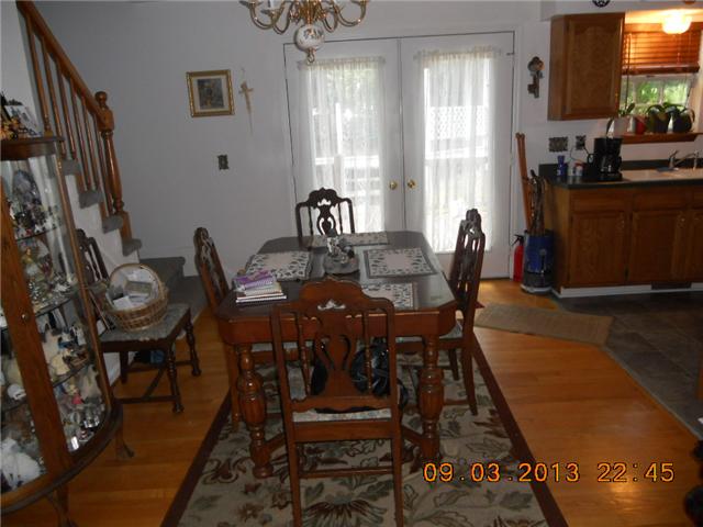 904 Woodhaven Road Lyles, TN 37098 - Photo 8 of 15 Dining area, showing stairway to upper level.