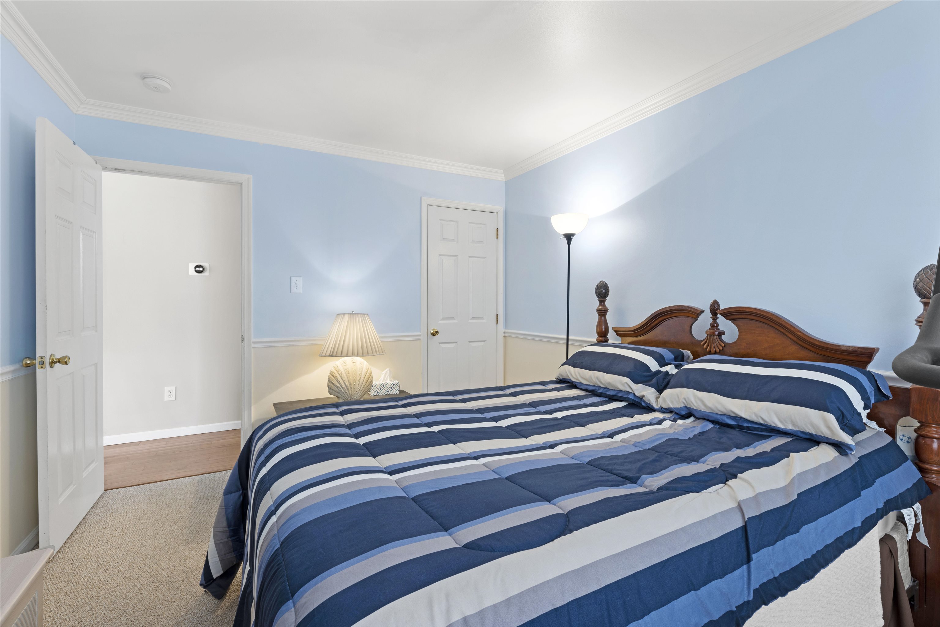 512 West Andrews Avenue, Unit B Wildwood, NJ 08260 - Photo 12 of 25 a bedroom with a bed and a lamp