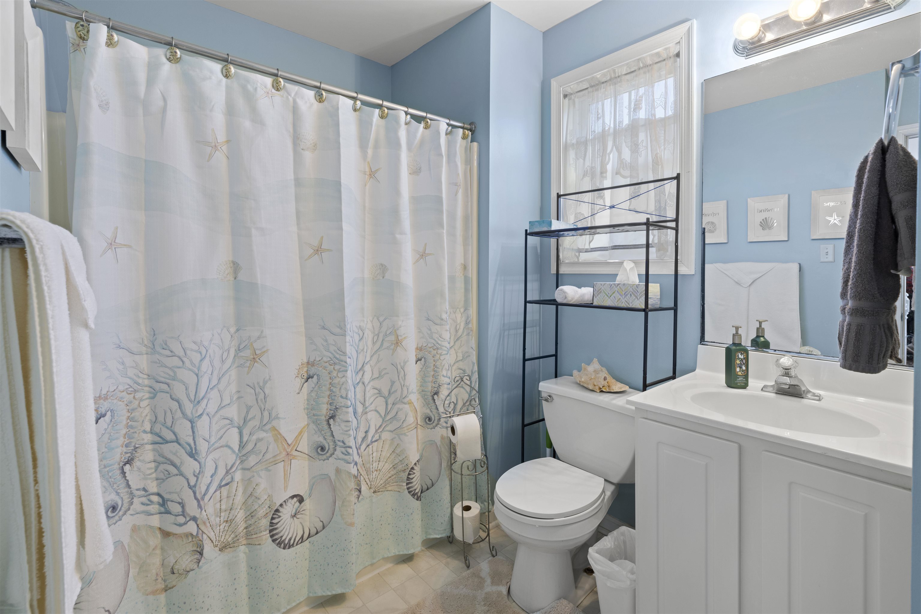 512 West Andrews Avenue, Unit B Wildwood, NJ 08260 - Photo 16 of 25 a bathroom with a sink toilet and shower