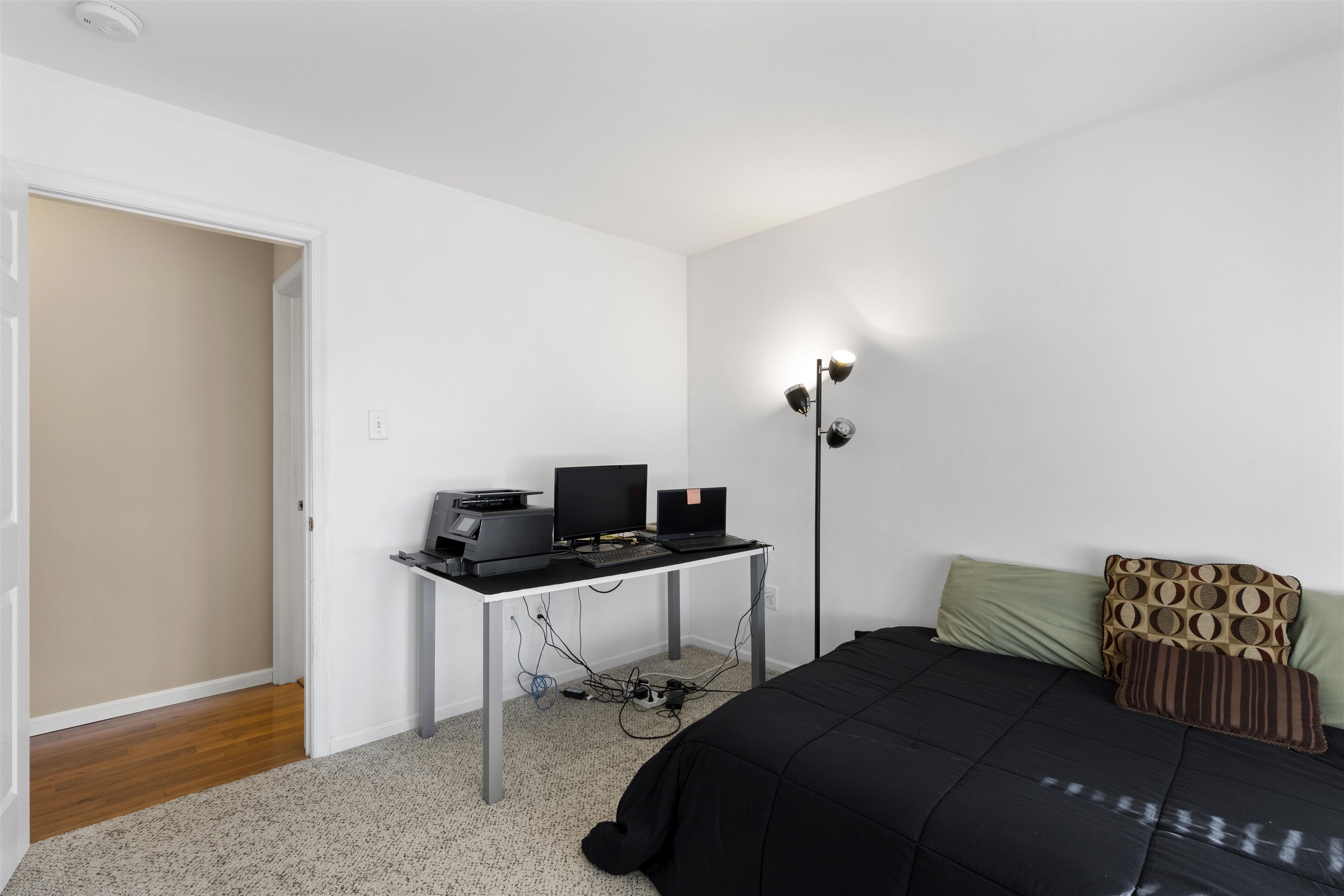 512 West Andrews Avenue, Unit B Wildwood, NJ 08260 - Photo 18 of 25 a bedroom with a bed and a desk