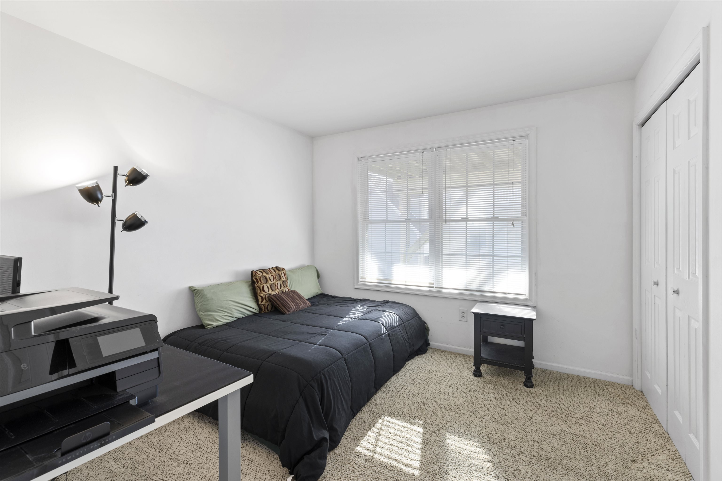 512 West Andrews Avenue, Unit B Wildwood, NJ 08260 - Photo 19 of 25 a bedroom with a bed and a window