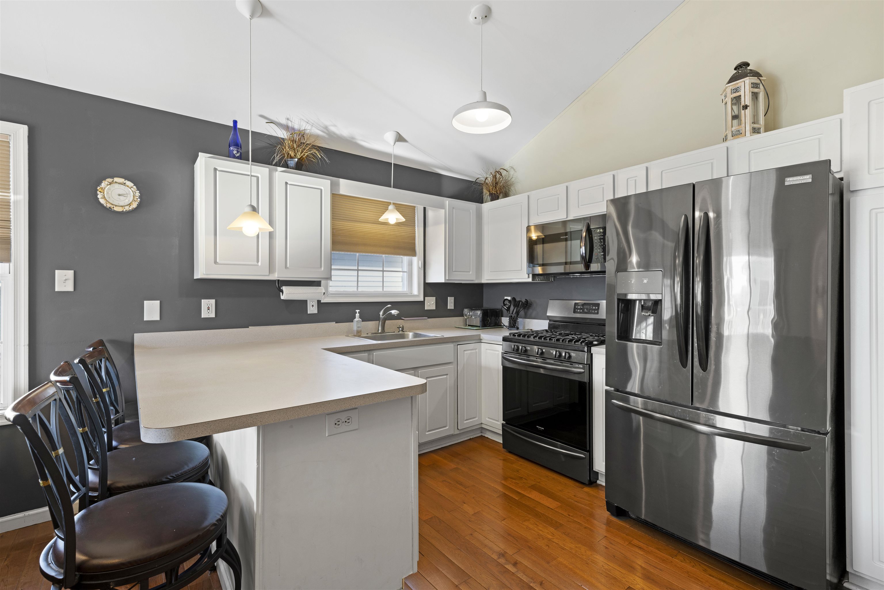 512 West Andrews Avenue, Unit B Wildwood, NJ 08260 - Photo 8 of 25 a kitchen with a refrigerator a stove a sink and a microwave
