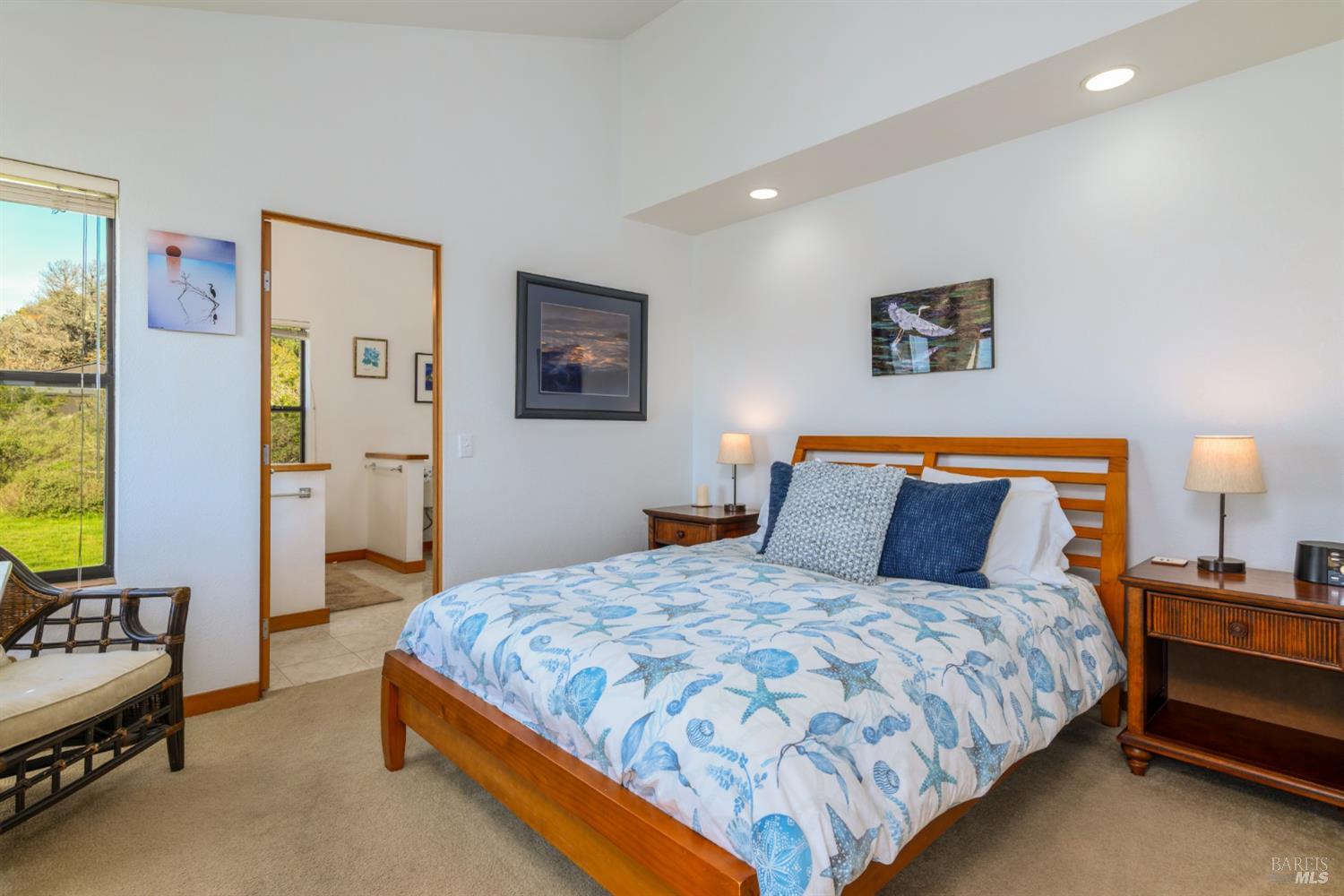 39722 Leeward Road, Unit 28 The Sea Ranch, CA 95497 - Photo 12 of 30 a bedroom with a bed and lamp