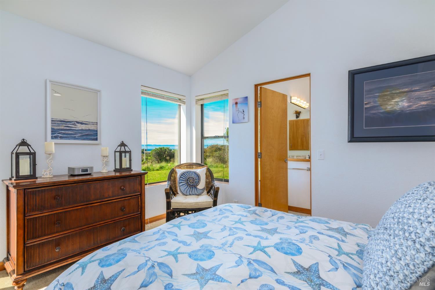 39722 Leeward Road, Unit 28 The Sea Ranch, CA 95497 - Photo 13 of 30 a bedroom with a bed and wooden floor
