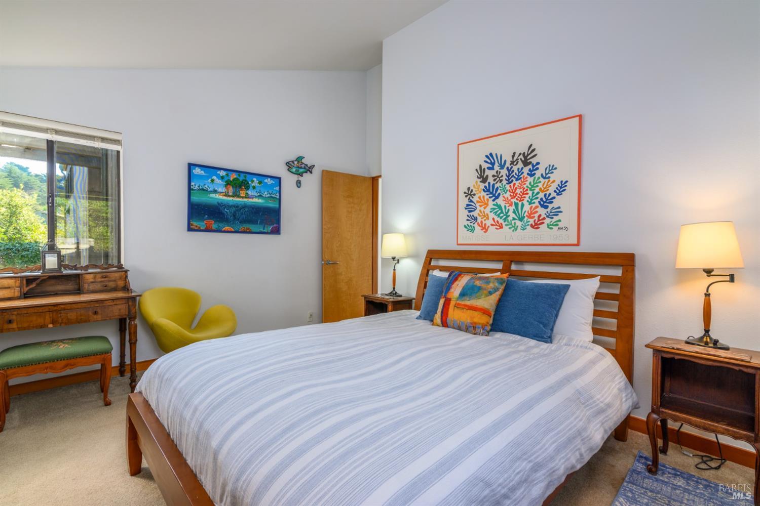 39722 Leeward Road, Unit 28 The Sea Ranch, CA 95497 - Photo 15 of 30 a bedroom with a bed and wooden floor