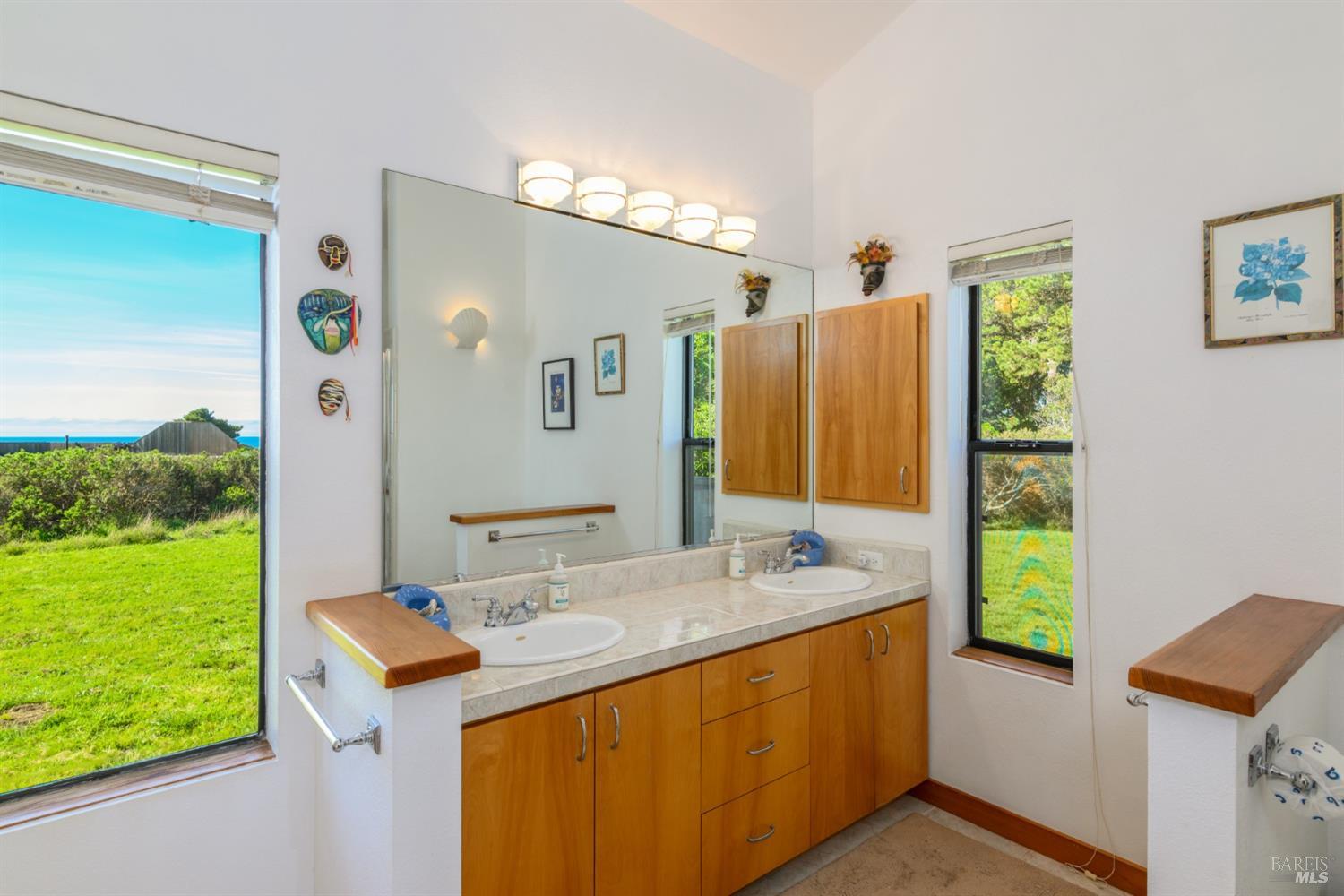 39722 Leeward Road, Unit 28 The Sea Ranch, CA 95497 - Photo 17 of 30 a bathroom with a double vanity sink and a mirror