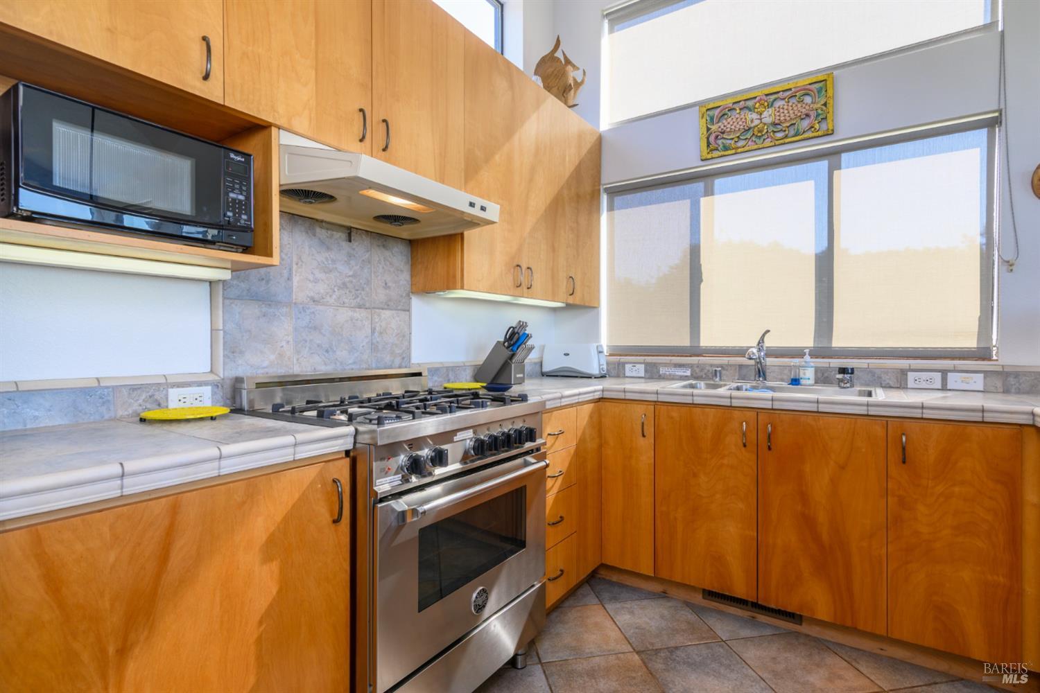 39722 Leeward Road, Unit 28 The Sea Ranch, CA 95497 - Photo 7 of 30 a stove top oven sitting inside of a kitchen