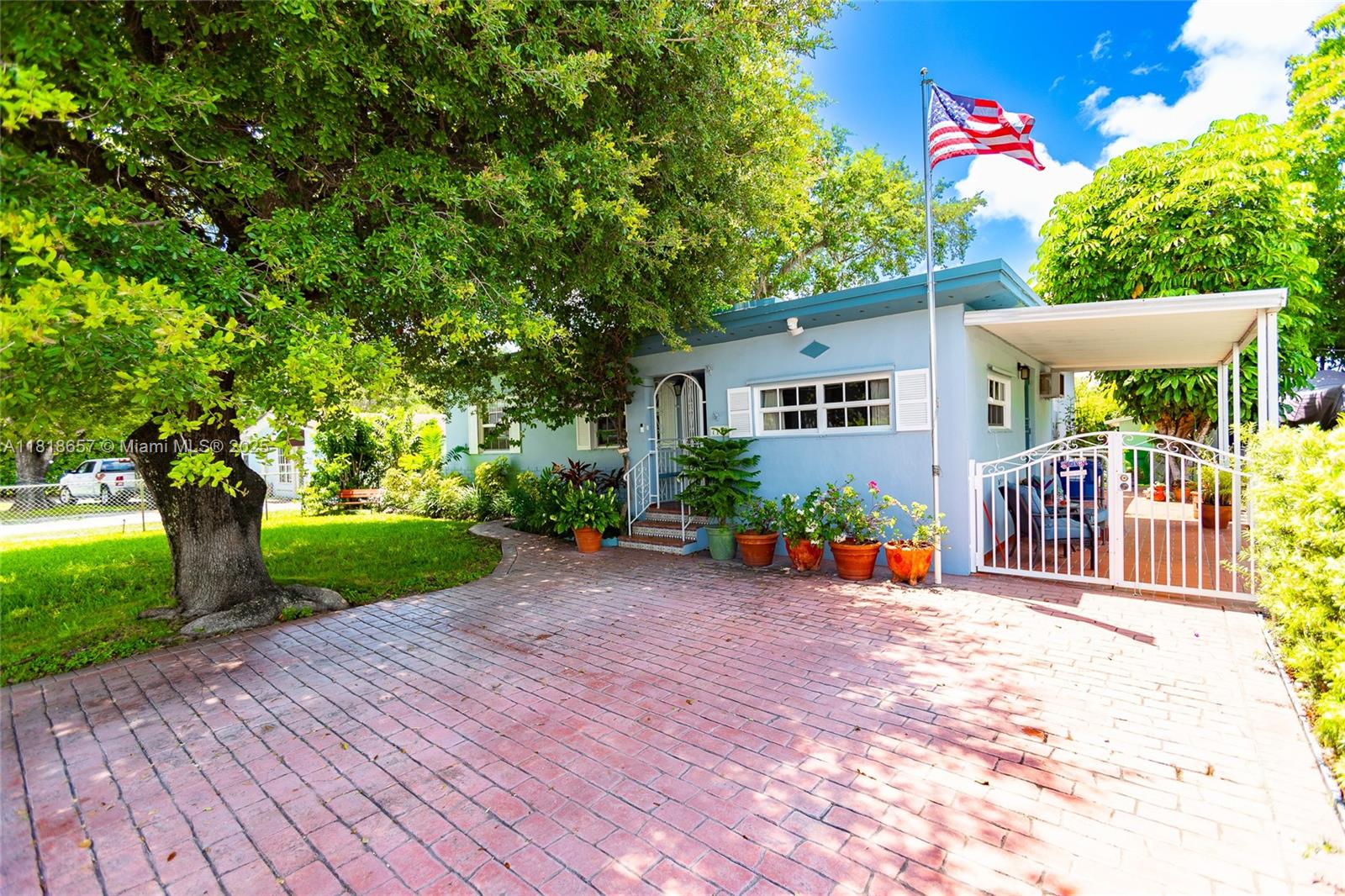 a front view of a house with garden