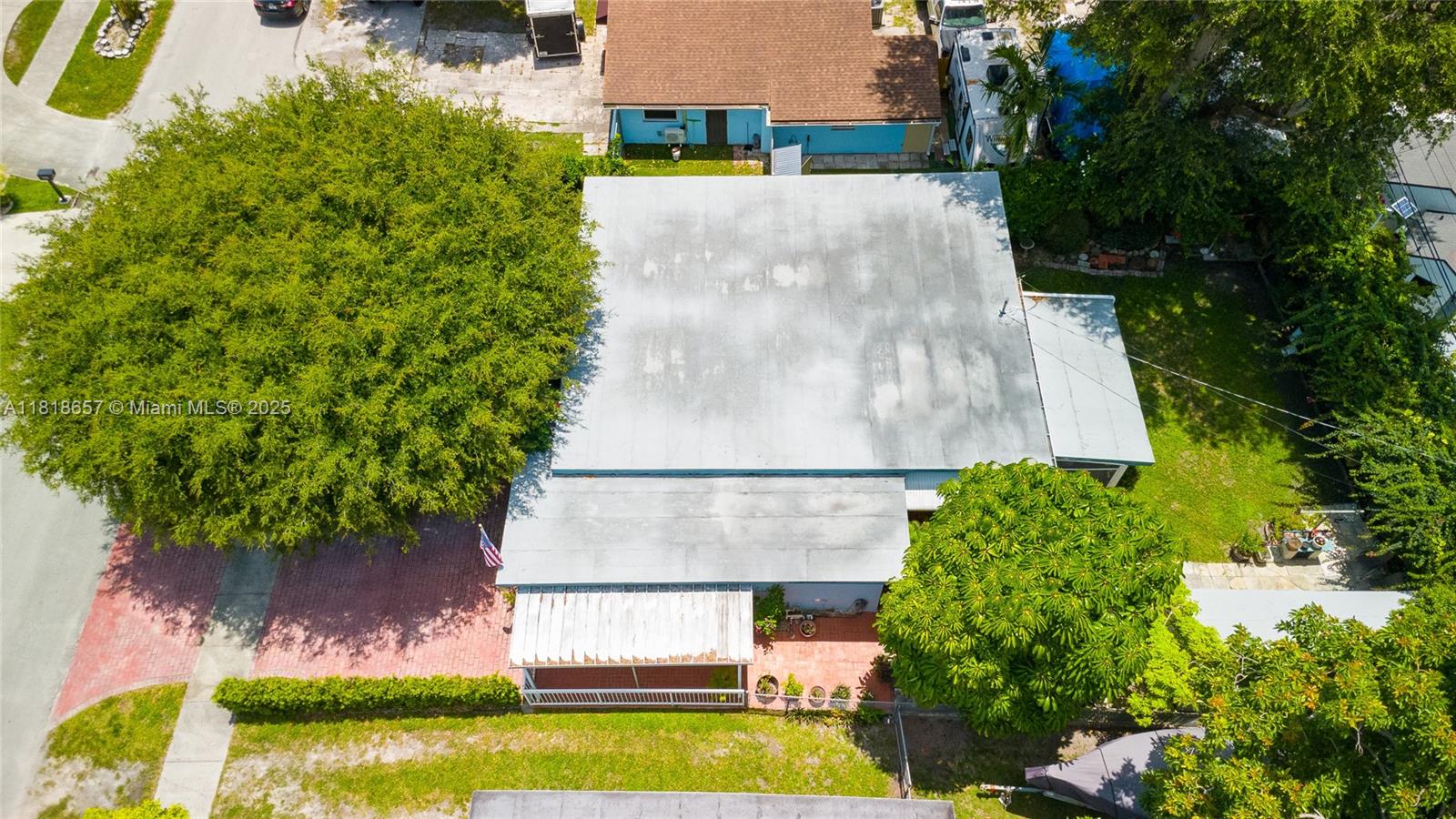 7110 Southwest 13th Terrace Miami, FL 33144 - Photo 11 of 48 a view of a swimming pool with a yard