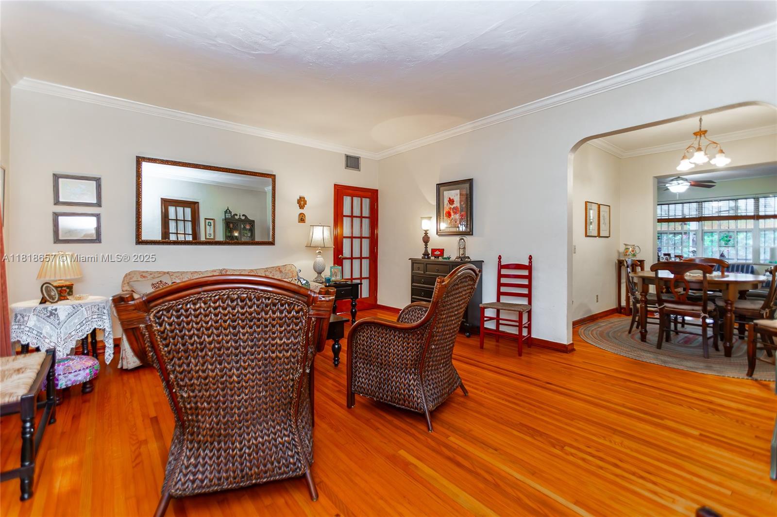7110 Southwest 13th Terrace Miami, FL 33144 - Photo 15 of 48 a living room with furniture and wooden floor