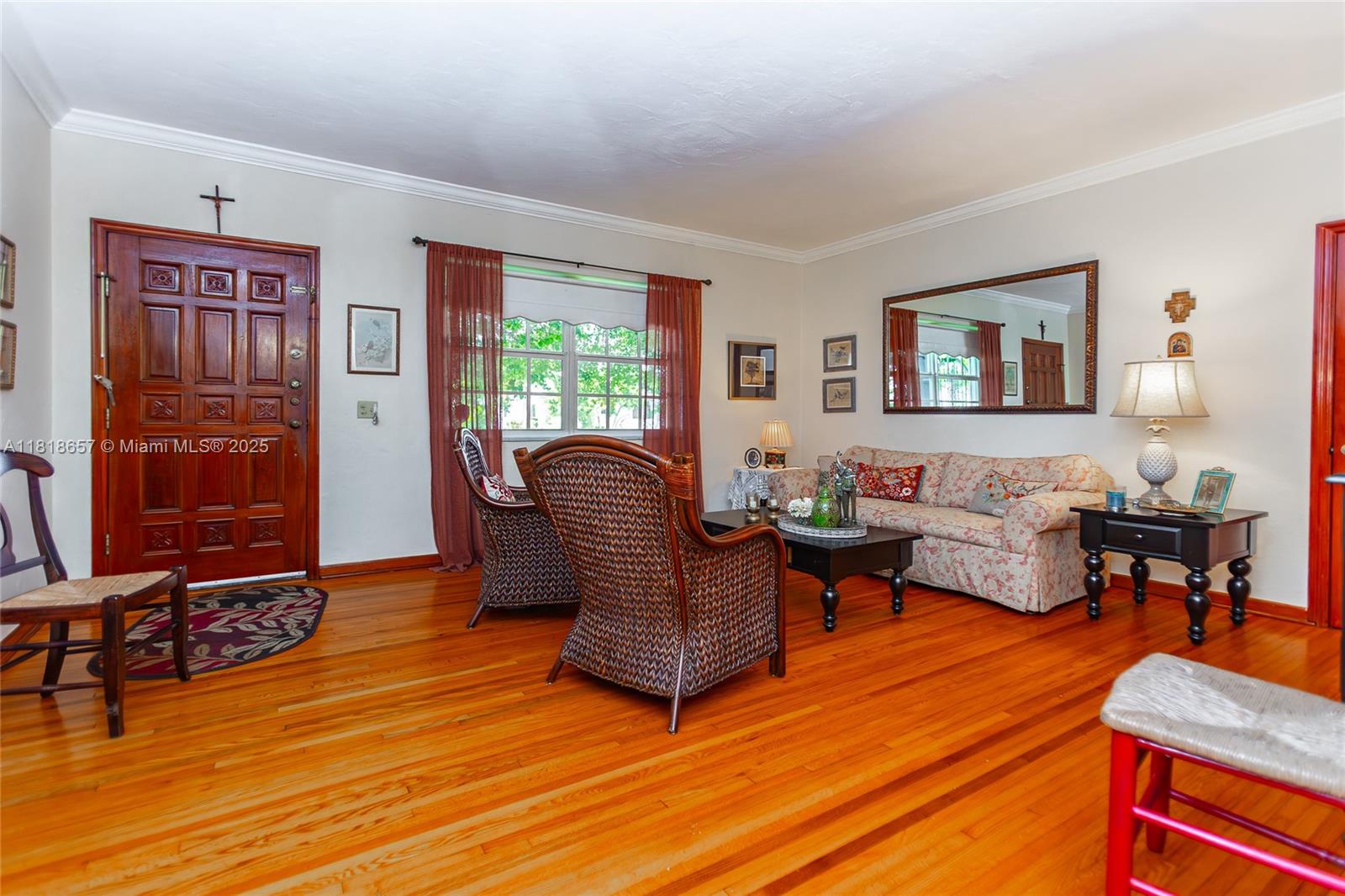 7110 Southwest 13th Terrace Miami, FL 33144 - Photo 16 of 48 a living room with furniture and wooden floor