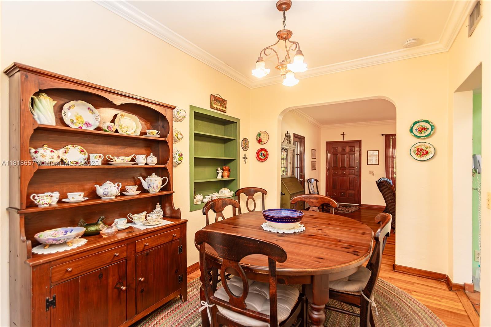 7110 Southwest 13th Terrace Miami, FL 33144 - Photo 19 of 48 a view of a dining room with furniture and chandelier