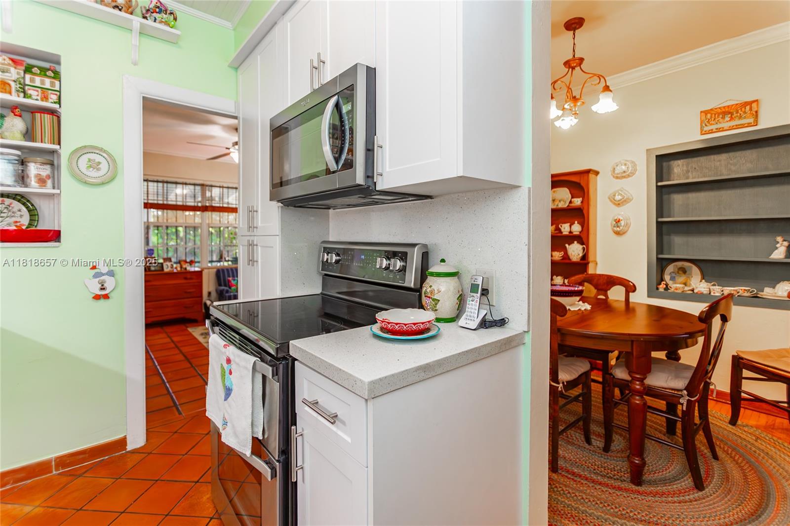 7110 Southwest 13th Terrace Miami, FL 33144 - Photo 23 of 48 a table and chairs in a kitchen