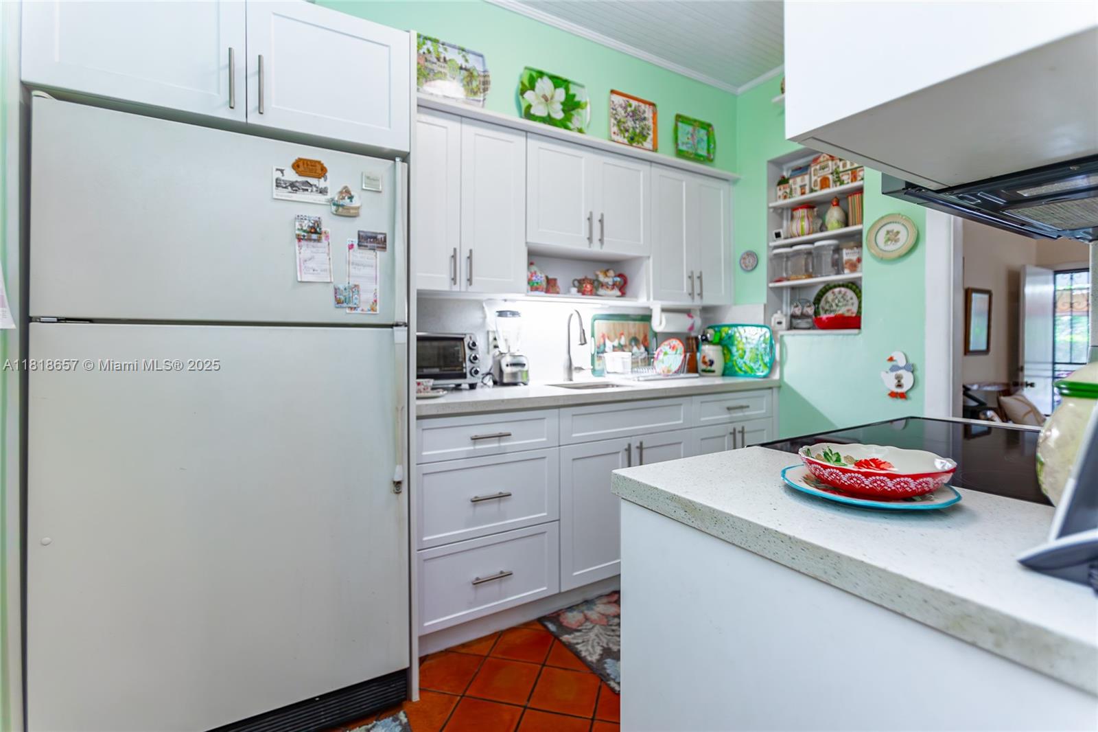 7110 Southwest 13th Terrace Miami, FL 33144 - Photo 25 of 48 a white refrigerator freezer sitting in a kitchen