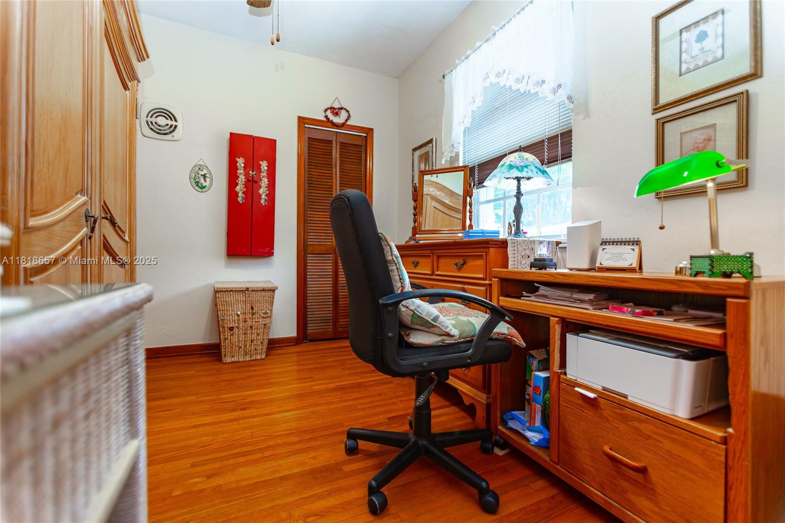 7110 Southwest 13th Terrace Miami, FL 33144 - Photo 26 of 48 a view of a workspace with furniture and a window