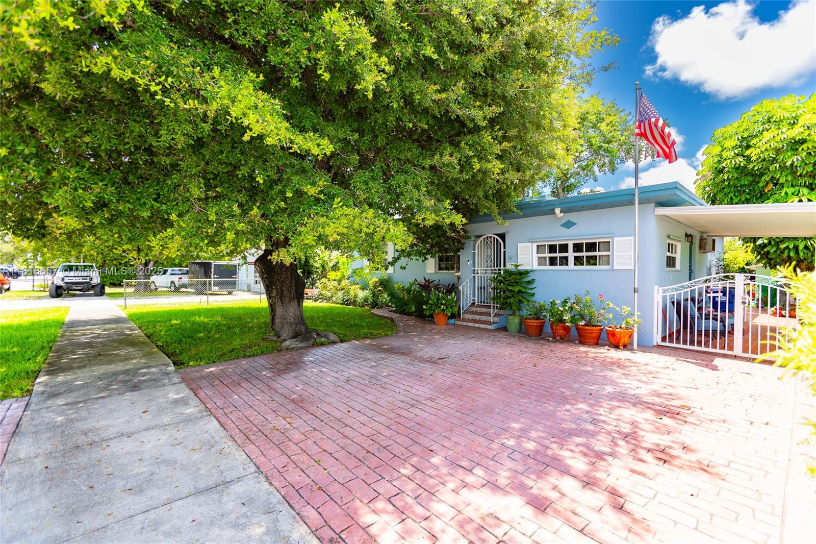 7110 Southwest 13th Terrace Miami, FL 33144 - Photo 3 of 48 a view of a park with plants and a bench