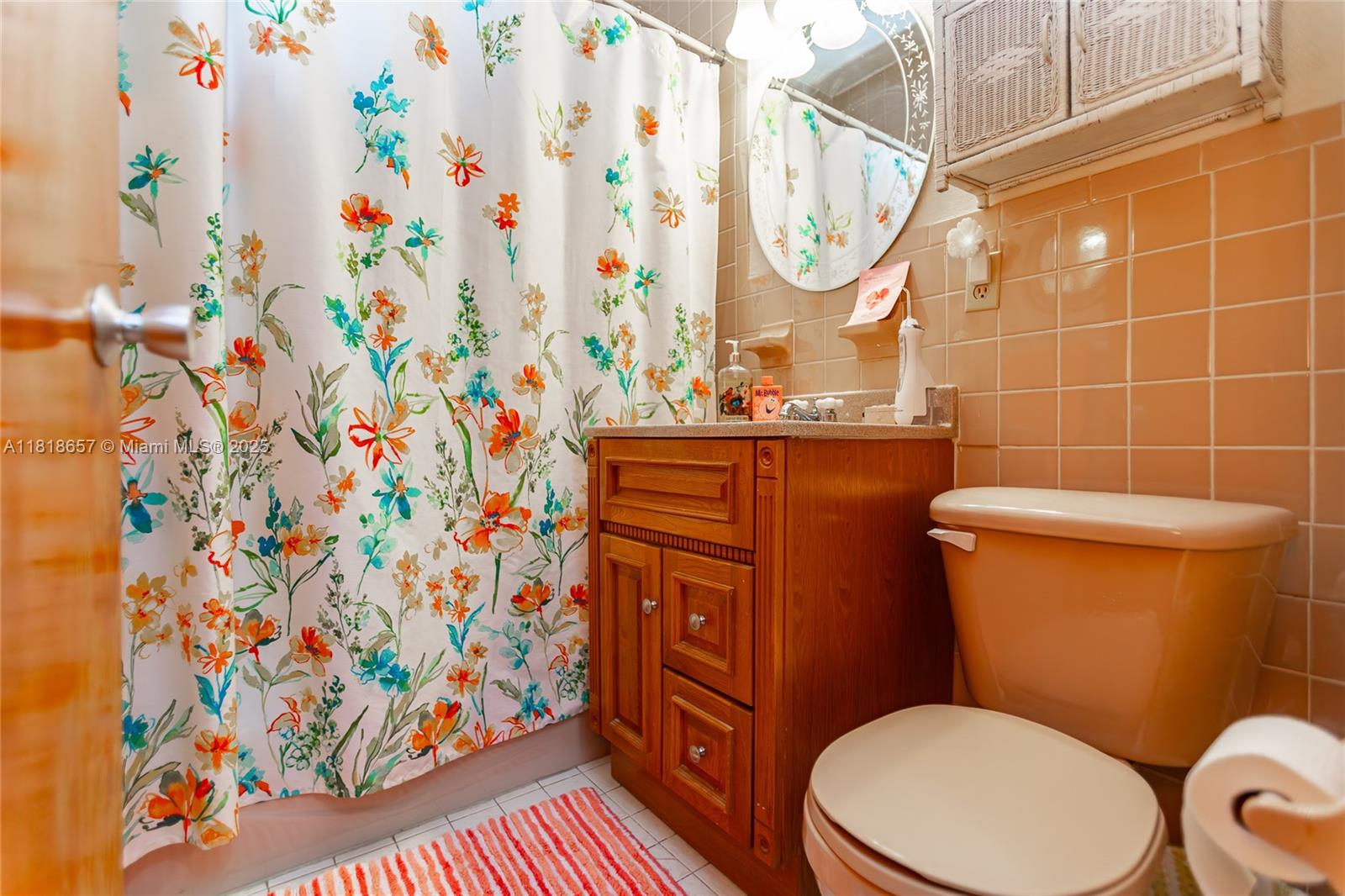 7110 Southwest 13th Terrace Miami, FL 33144 - Photo 31 of 48 a bathroom with a toilet and a sink