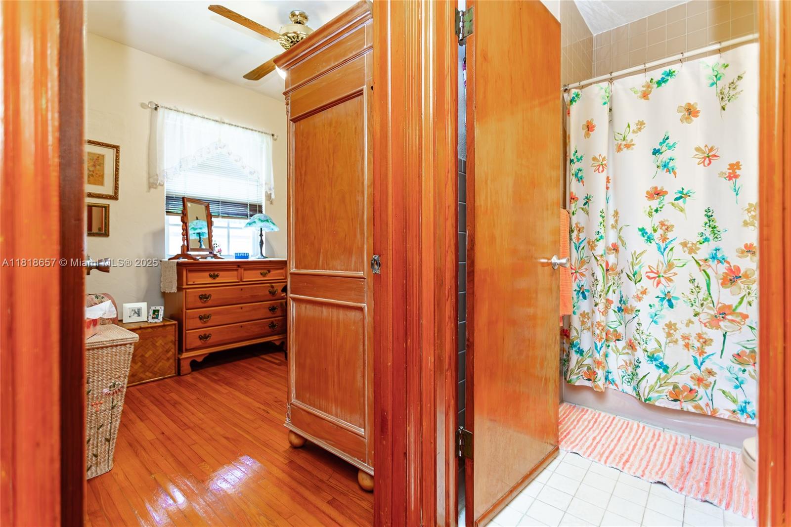 7110 Southwest 13th Terrace Miami, FL 33144 - Photo 32 of 48 a room with wooden floor and furniture