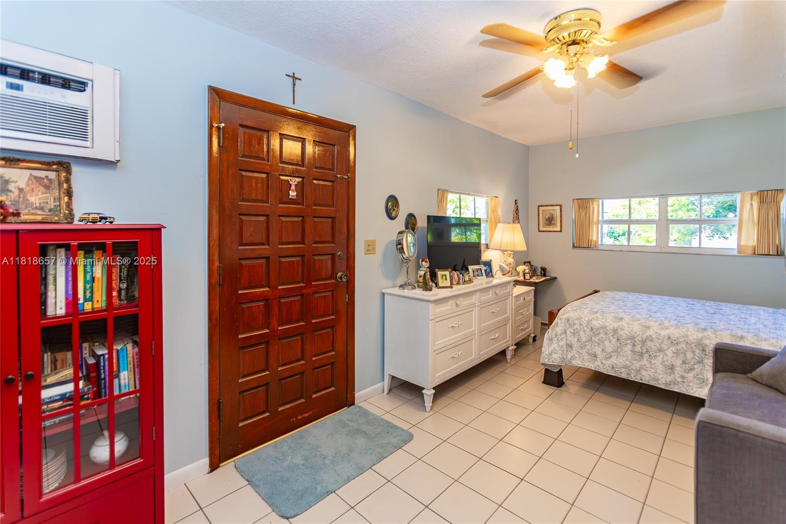 7110 Southwest 13th Terrace Miami, FL 33144 - Photo 35 of 48 a living room with furniture and a baby crib