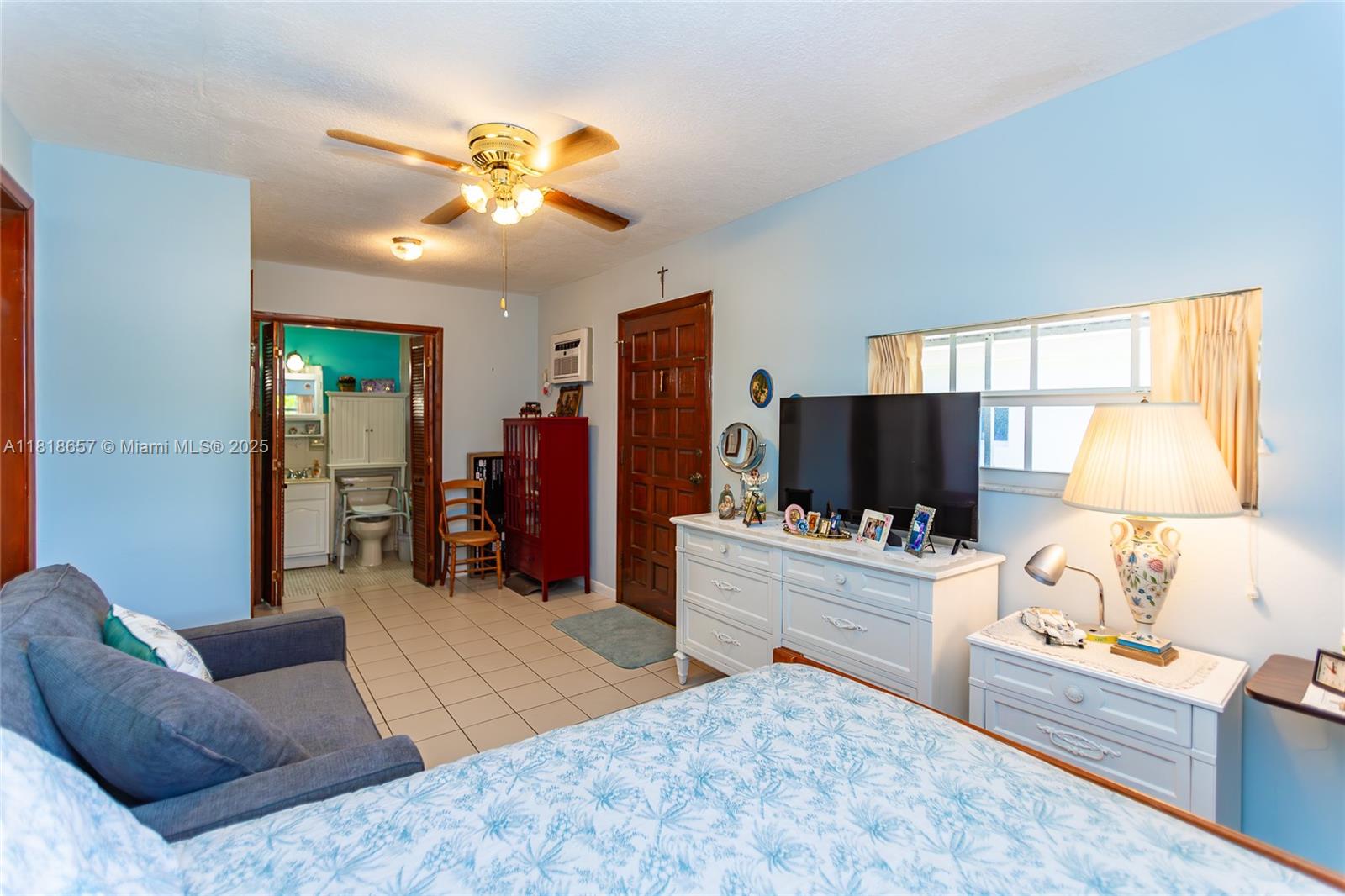 7110 Southwest 13th Terrace Miami, FL 33144 - Photo 37 of 48 a living room with furniture and a flat screen tv