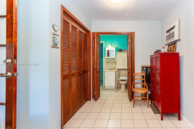 a bathroom with a toilet and a sink curtain