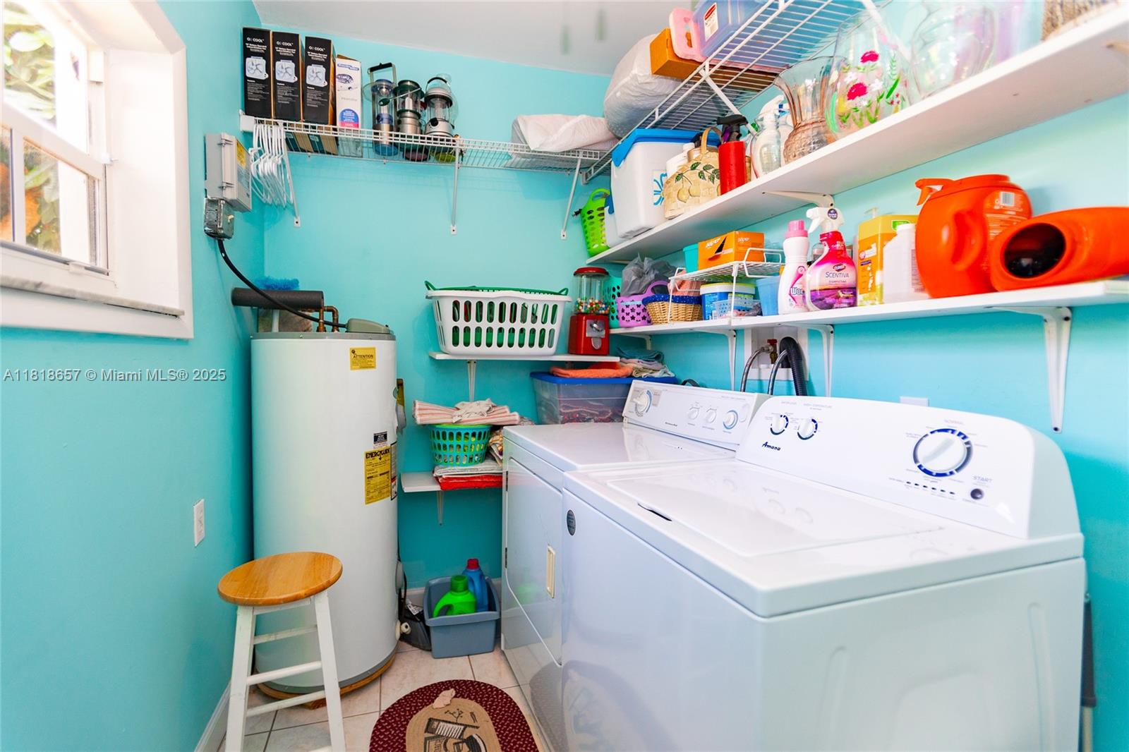 7110 Southwest 13th Terrace Miami, FL 33144 - Photo 40 of 48 a utility room with a refrigerator and a table